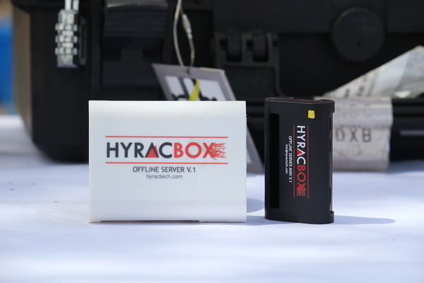 Hyracbox Edge units on a table at a field deployment — the portable, low-power offline server